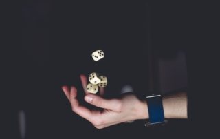 person predicting and playing with dice